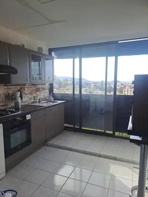 a kitchen with a large window with a view at La bella vista in Nice
