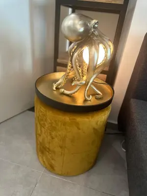 a bronze statue of two birds sitting on a barrel at Studio Coeur Delille FSHH in Nice