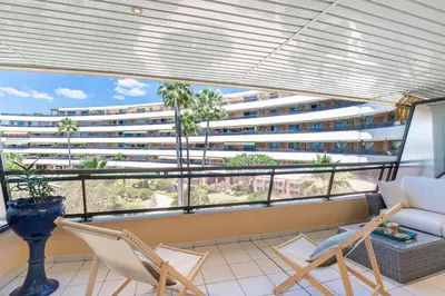 a balcony with a view of a large building at Suite HAITI FSHH in Saint-Laurent-du-Var