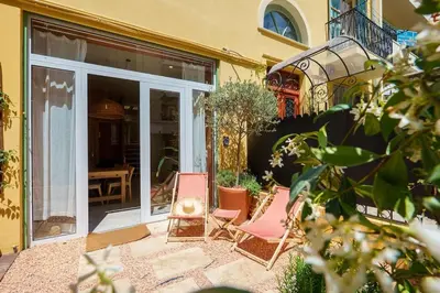 two chairs sitting on a patio outside of a house at Nice - Amazing flat to 10 min to sea - Garden in Nice