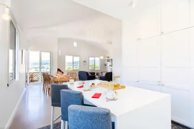 a living room with a white table and chairs at #54 Sea view Villa 4 BDR AC 5mins to Port BBQ in Nice