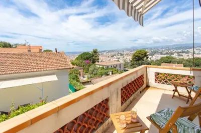 a balcony with a view of a city at #54 Sea view Villa 4 BDR AC 5mins to Port BBQ in Nice