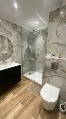 a bathroom with a toilet and a sink and a shower at face à la mer in Cros-de-Cagnes