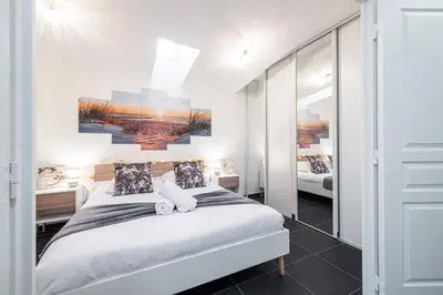 a bedroom with a bed with two pillows at Large & Quiet 1 Bdr at Nice Port in Nice