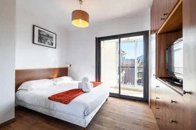 a bedroom with a bed and a large window at Open Sky Terrace Lage 1 Bdr & Parking in Nice