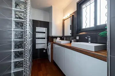 a bathroom with two sinks and a mirror at Open Sky Terrace Lage 1 Bdr & Parking in Nice
