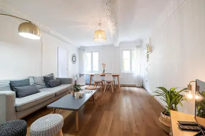 a living room with a couch and a table at 2 Bdr Heart of the Old Town in Nice