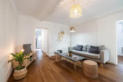 a living room with a couch and a table at 2 Bdr Heart of the Old Town in Nice