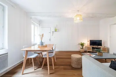 a living room with a table and a couch at 2 Bdr Heart of the Old Town in Nice