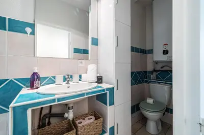 a bathroom with a sink and a toilet at 2 Bdr Heart of the Old Town in Nice