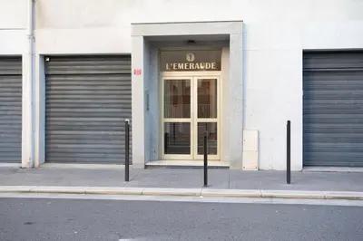 a building with two garage doors on a street at #19 Lenval - Balcon Lenval Sea View with AC Promenade des Anglais in Nice
