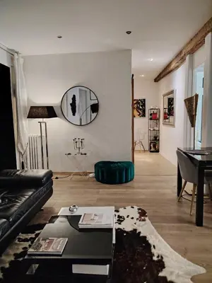 a living room with a couch and a table at Movida in Nice
