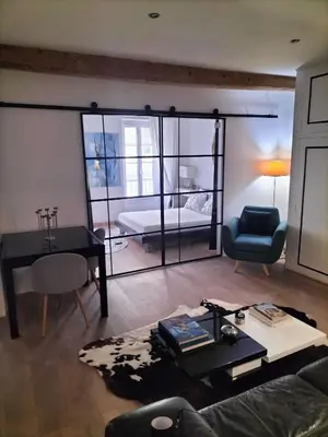 a living room with a couch and a table at Movida in Nice