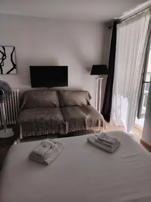 a bedroom with a bed with two towels on it at Movida in Nice