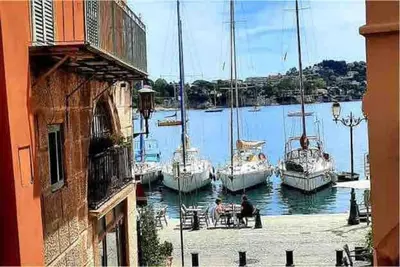 a group of boats are docked in a harbor at Petit cocon in Villefranche-sur-Mer