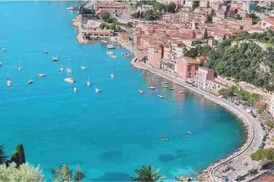 a view of a beach with boats in the water at Petit cocon in Villefranche-sur-Mer
