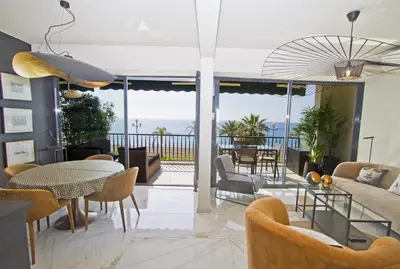 a living room with a view of the ocean at Luxury Flat Beachfront Nice in Nice