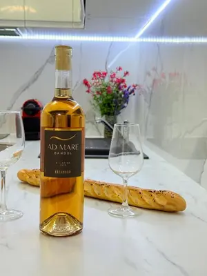 a bottle of wine and two wine glasses on a table at Central place close to the beach AC air , WI FI, parking in Nice