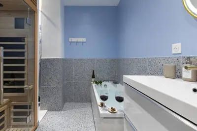 a bathroom with two glasses of wine on a counter at Lavie Maison Sauna and Hot Tub Seaside in Nice