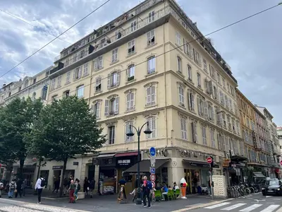 a large building on the corner of a city street at Studio Sydney - Jean Médecin - LA RIVIERA LCD in Nice
