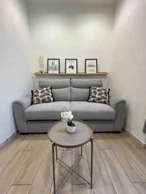 a living room with a couch and a table at Studio Sydney - Jean Médecin - LA RIVIERA LCD in Nice