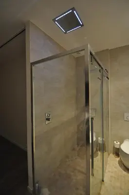 a bathroom with a shower with a toilet and a sink at Superbe villa piscine proche ville et mer au calme in Nice