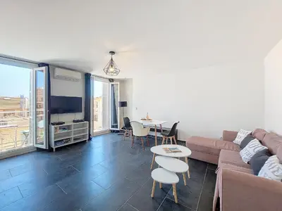 a living room with a couch and a table at Nestor&Jeeves - GIOFFREDO BELLO - central - near beach in Nice