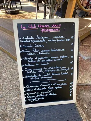 a chalkboard sign with writing on it on a sidewalk at Superbe appartement de 3p pieces dans residence avec piscine et climatisation in Nice
