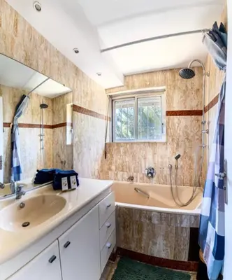 a bathroom with a sink and a tub and a shower at Magnificent 3 Rooms-Sea View-Terrace-Pool in Nice