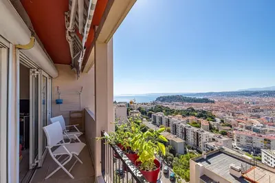 a balcony with a view of a city at 2 PIECEs BALCON VUE IMPRENABLE MER---VILLE---MONTAGNE in Nice