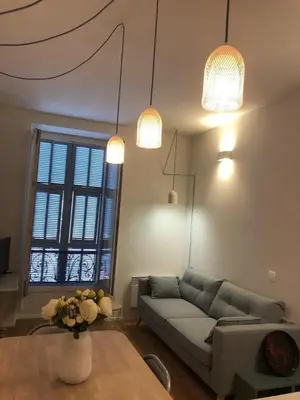 a living room with a couch and a table at Suite Offenbach FSHH in Nice