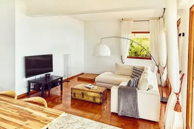 a living room with a couch and a tv at Best View ever! in Èze