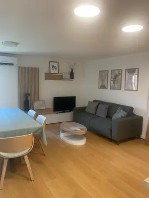 a living room with a couch and a table at Historic Bright and Beautiful Apartment in Old Nice with Castle Hill View in Nice