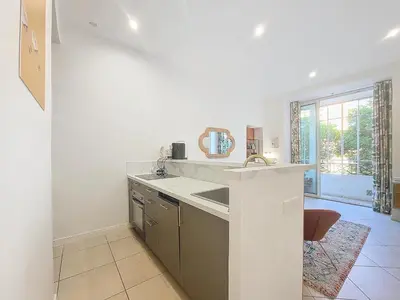 a kitchen with a sink and a mirror on the wall at Nestor&Jeeves - BEL AIR - City Center - Modern in Nice