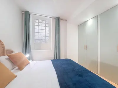 a bedroom with a large bed and a window at Nestor&Jeeves - BEL AIR - City Center - Modern in Nice