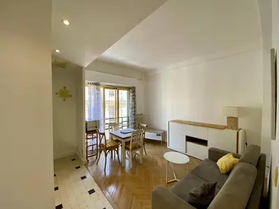 a living room with a couch and a table at Nice Hypercentre- Joli 2Pièces in Nice