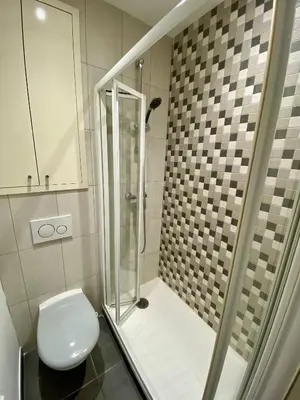 a bathroom with a toilet and a glass shower at Nice Hypercentre- Joli 2Pièces in Nice