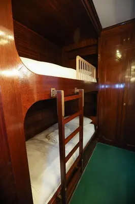 a couple of bunk beds in a boat at Appartement exception les pieds dans l'eau in Èze