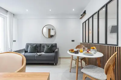a living room with a couch and a table at MY CASA - SMOLETT - Superb Studio Suite Downtown w AC in Nice