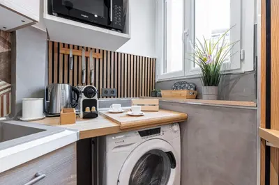 a kitchen with a washing machine on a counter at MY CASA - SMOLETT - Superb Studio Suite Downtown w AC in Nice