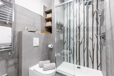 a bathroom with a shower and a toilet at MY CASA - SMOLETT - Superb Studio Suite Downtown w AC in Nice