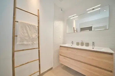 a bathroom with a sink and a mirror at Unique appartement à Nice vue mer imprenable in Nice