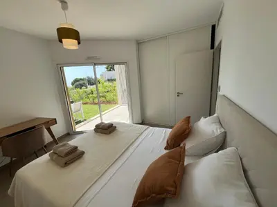 a bedroom with a large white bed with a window at Unique appartement à Nice vue mer imprenable in Nice