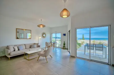 a living room with a couch and a table at Unique appartement à Nice vue mer imprenable in Nice