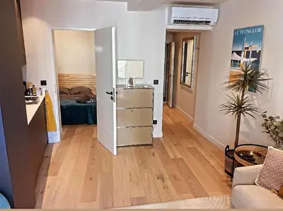 a room with a living room with a room with at Masséna street, 2 rooms balcony in Nice