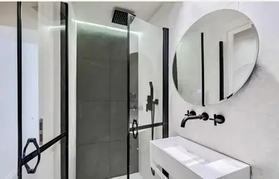 a bathroom with a shower and a sink and a mirror at Masséna street, 2 rooms balcony in Nice