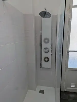 a shower with a glass door in a bathroom at 3 Pièces 70m2 Coeur de Nice in Nice