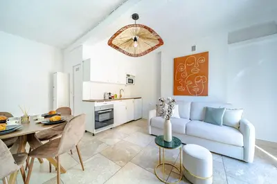 a living room with a couch and a table at Charmant Appartement 2P au Cœur du Vieux Nice in Nice