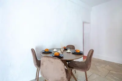 a dining room table with chairs and pumpkins on it at Charmant Appartement 2P au Cœur du Vieux Nice in Nice