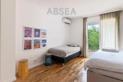 a bedroom with two beds and a window at Nice Absea Fabron 2 in Nice
